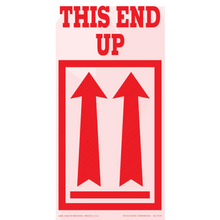 Red ’THIS END UP’ shipping label with upward-pointing arrows.